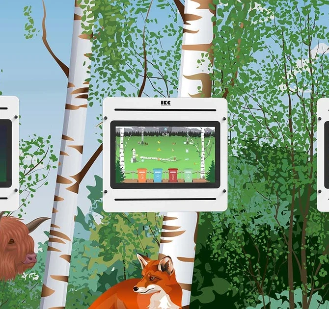 IKC interactive touch screens set into a forest-themed wall