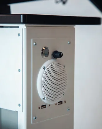 Integrated speaker, volume control and USB ports